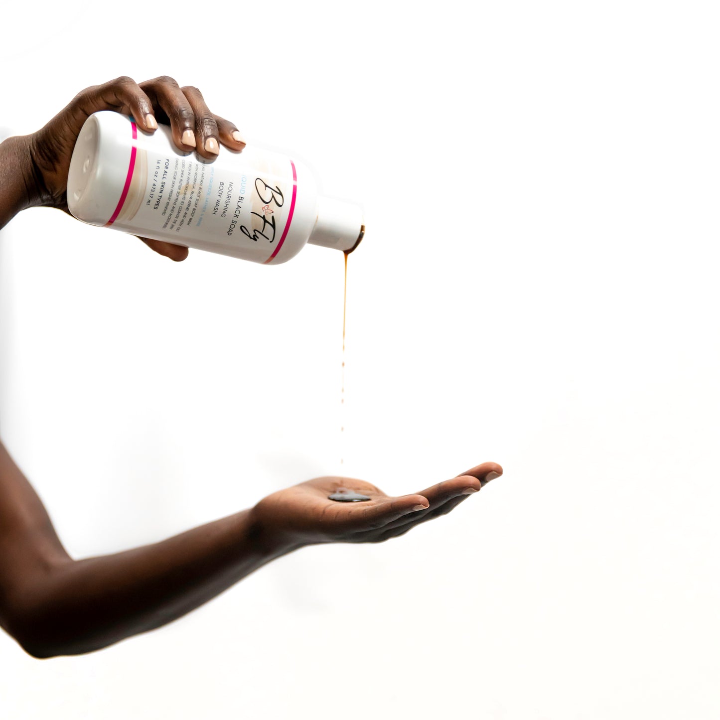 B Fly Liquid Black Soap Body Wash in squeeze bottle with moisturizing, amber-colored liquid, enriched with Shea Butter, Neem Oil, and Palm Kernel Oil.