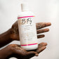 B Fly Liquid Black Soap Body Wash in squeeze bottle with moisturizing, amber-colored liquid, enriched with Shea Butter, Neem Oil, and Palm Kernel Oil.
