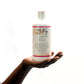 B Fly Liquid Black Soap Body Wash in squeeze bottle with moisturizing, amber-colored liquid, enriched with Shea Butter, Neem Oil, and Palm Kernel Oil.