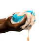 B Fly Liquid Black Soap Body Wash  squeezed on a B Fly Sapo Sponge, amber-colored liquid, enriched with Shea Butter, Neem Oil, and Palm Kernel Oil.